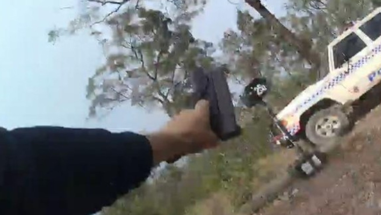 A still from Randall Kirk’s body-worn camera running from the Train’s Wieambilla property while being shot at. Picture: Supplied