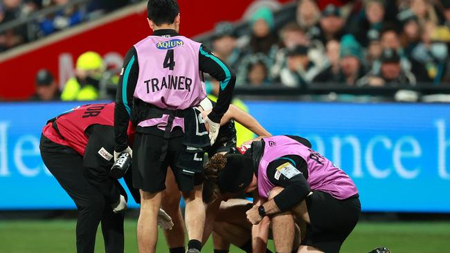 Todd Marshall was in the hands of trainers after diving for the ball early in the first quarter. Picture: Kelly Defina/Getty Images