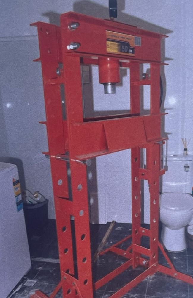 Crime scene image of the hydraulic press allegedly found in the bathroom of Ms Hynes’s Blackwall home. Picture: Supplied