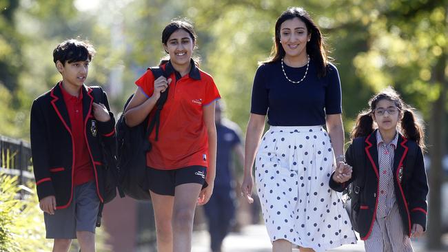 Kiri Burji with her children Hema, Harry and Hana Bains outside Ballarat Clarendon College. Picture: Yuri Kouzmin