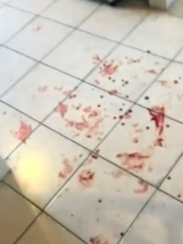 Blood stains on the floor after residents rushed inside for safety. Picture: 7 NEWS