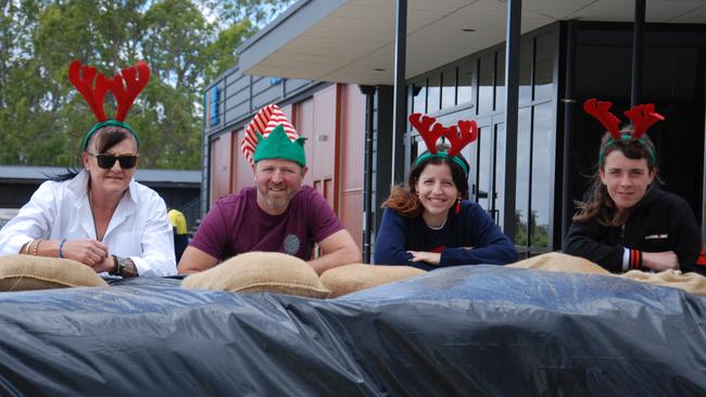 1924 Riverside Steakhouse staff Lisa Hay, manager Damien O'Riley, Cailyn Sutcliffe and Corey Iredale catch up to finalise preparations as the business closed on Sunday, December 11 ahead of peak River Murray flows. Picture: Dylan Hogarth