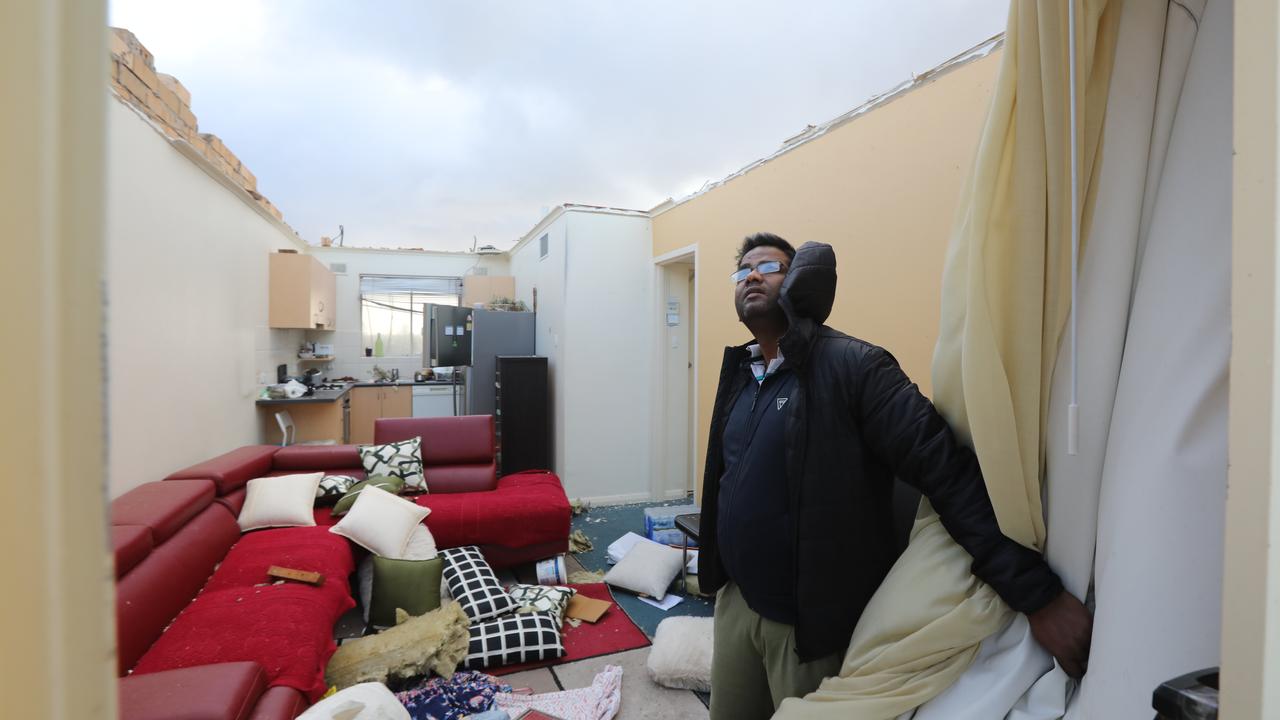 Surinder Kumar inside his Glenelg North apartment, where the roof blew off in the storm. Picture: AAP / Russell Millard