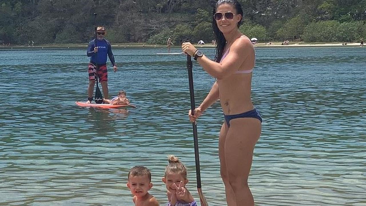 Hannah Clarke paddle-boarding with two of her children.