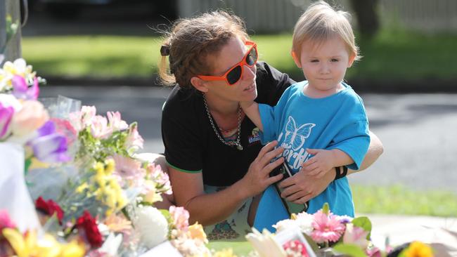 People visit the scene to pay respects to Hannah Clarke and her three children Aaliyah, 6, Laianah, 4, and Trey, 3. Picture: Peter Wallis