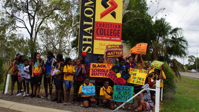 Shalom Christian College students protest out the front of their campus against the closure of the senior school.