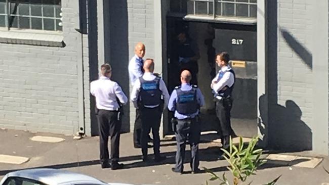 Police at Mark Thompson’s front door. Picture: Supplied