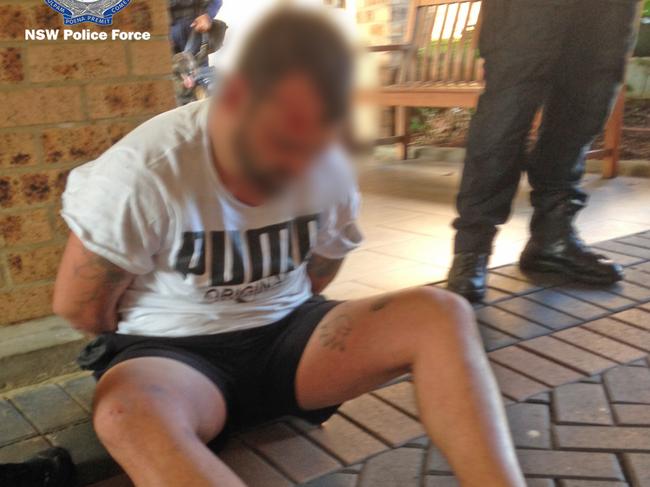 Jason Bridge is arrested outside a hotel in Castle Hill on Saturday. Picture: NSW Police