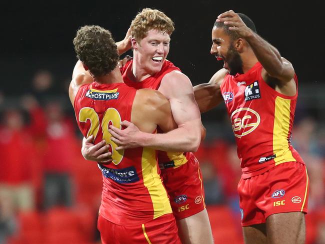 Matthew Rowell of the Suns celebrates a goal during the round 4 AFL match between the Gold Coast Suns and Fremantle Dockers at Metricon Stadium on June 27, 2020 in Gold Coast, Australia. (Photo by Chris Hyde/Getty Images)