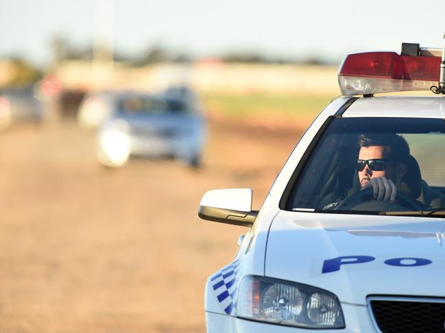 24/09/15 - Police on the scene at Waterloo Corner where a body has been found at the intersection of Mill Road and Short Road.Photo Tom Huntley