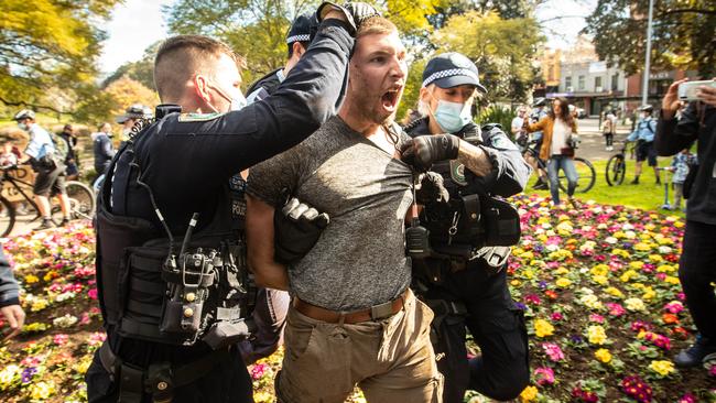 A Sydney protester in police custody. Picture: Julian Andrews