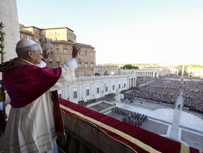 Newly elected Pope Leo XIV waves to faithful and pilgrims gathered in St. Peter's Square shortly after his election, Thursday, May 8, 2025. (Vatican Media via AP)