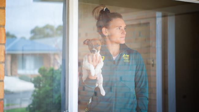 Olympian Bel White with her puppy Leo, in home quarantine. Picture: Tom Huntley