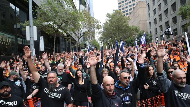 Many of the protesters wore and carried CFMEU shirts and flags. Picture: NCA NewsWire / David Crosling