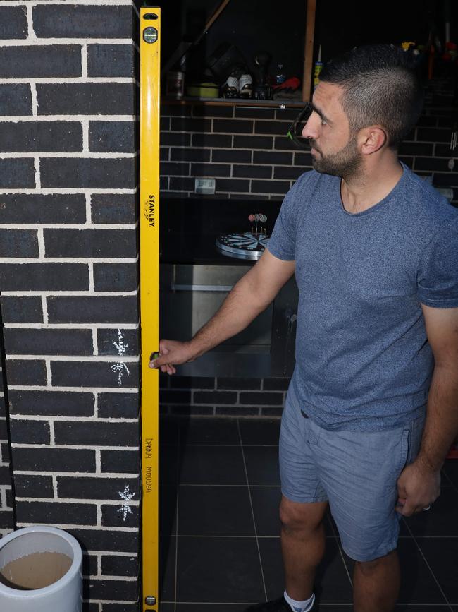 Danny Moussa pictured showing the damage to his home. Picture: Damian Shaw