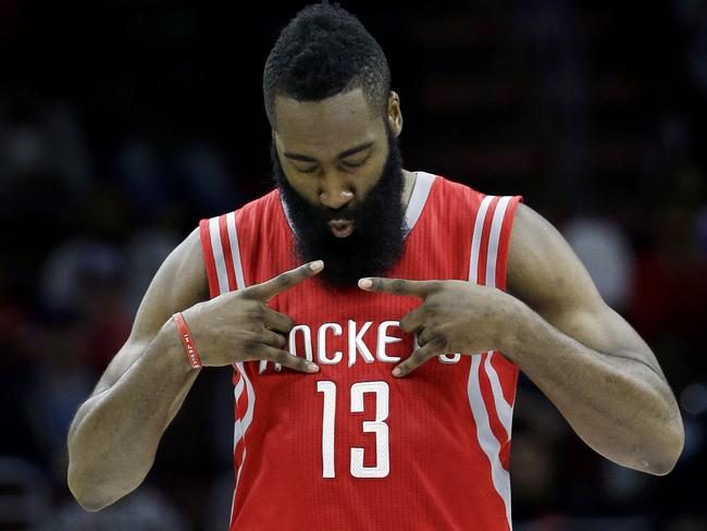 Houston Rockets' James Harden reacts after making a three-point shot.