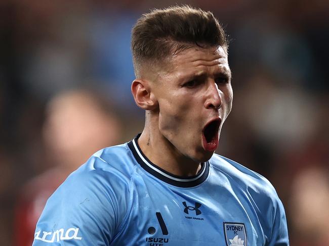 SYDNEY, AUSTRALIA - OCTOBER 19: Patryk Klimala of Sydney FC celebrates scoring a goal during the round one A-League Men match between Western Sydney Wanderers and Sydney FC at CommBank Stadium on October 19, 2024 in Sydney, Australia. (Photo by Jason McCawley/Getty Images)