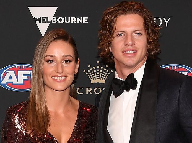 Nat Fyfe of the Fremantle Dockers and his partner Eleanor Brayshaw arrive at the 2019 Brownlow Medal ceremony at the Crown Palladium in Melbourne in Melbourne, Monday, September 23, 2019. (AAP Image/Julian Smith) NO ARCHIVING