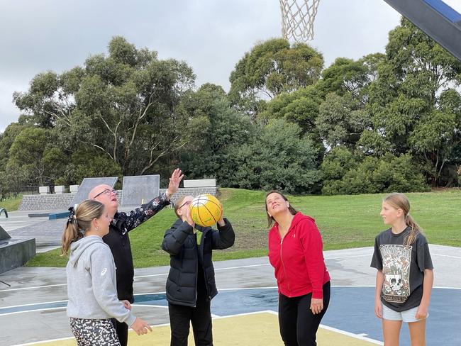 Wendouree MP Juliana Addison and Ballarat mayor Des Hudson play basketball with children at Sebastopol.