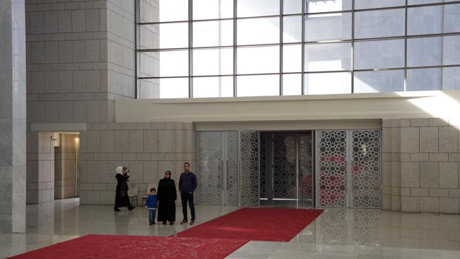 People wander inside the Presidential Palace where parts of it had been ransacked. Picture: Getty Images