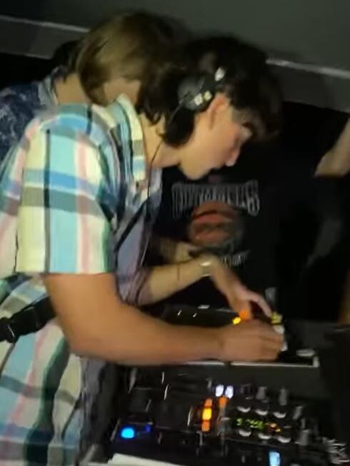 A DJ plays at a schoolies evening doof.