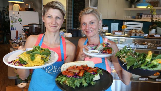 Way2Live Cafe owners and sisters Hana Kosikova and Iva Kafkova with plant-based Vietnamese dishes they will be offering this weekend. Picture: Robert Pozo