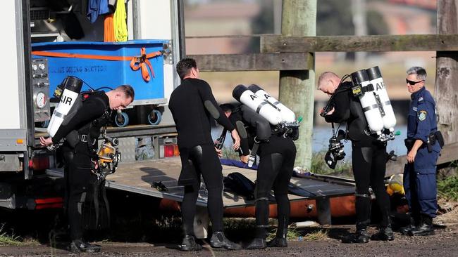 Police divers at Newcastle Port on Monday. Picture: Peter Lorimer.