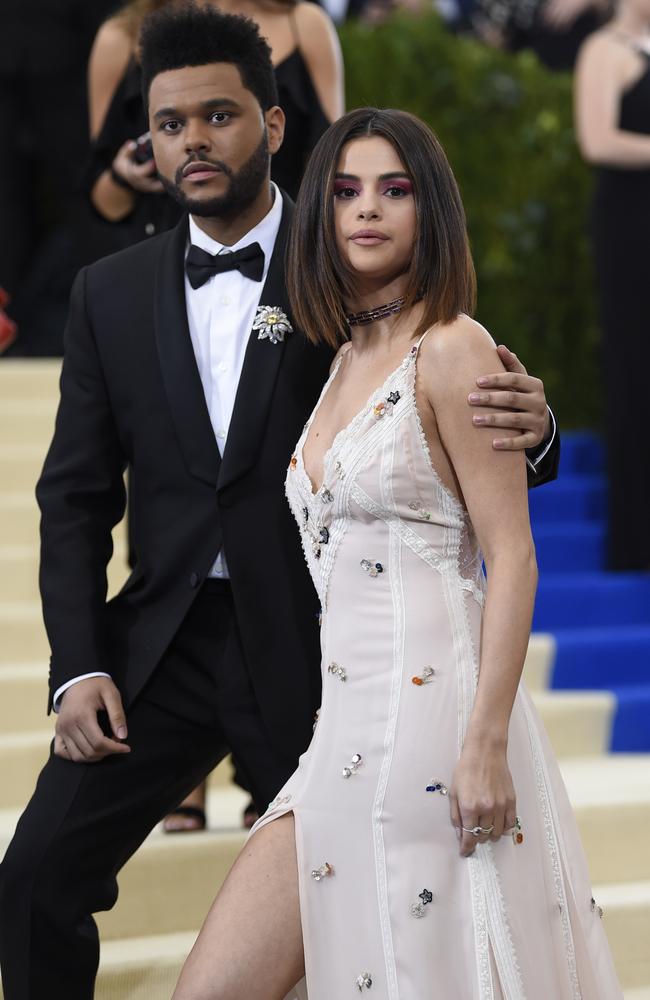 The Weeknd and Selena Gomez on the steps of the Met. Picture: AP