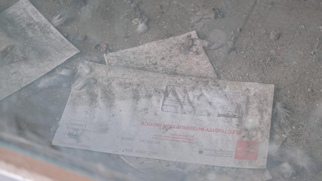 Unopened, dust-covered letters inside a long closed CBD shop. Picture: Shaun Viljoen