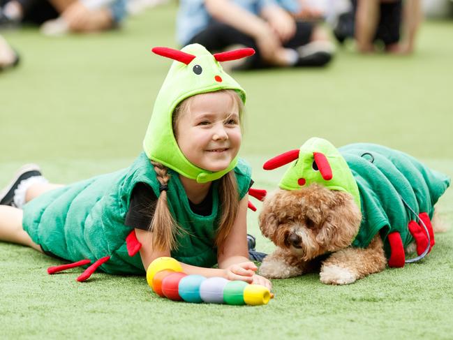 DAILY TELEGRAPH. Harri Simpson, 7, and her dog Monty, who won the Most Alike competition at the Pampered Pooch Parade at The Neutral Bay Club. Sunday 25/08/2024. Picture by Max Mason-Hubers