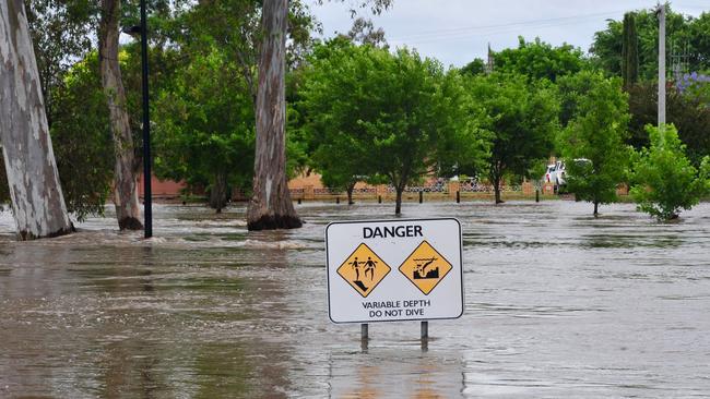 Floodwaters reach the top of a sign in Euroa, Victoria, on Saturday. Picture: AAP Image/Brendan McCarthy.