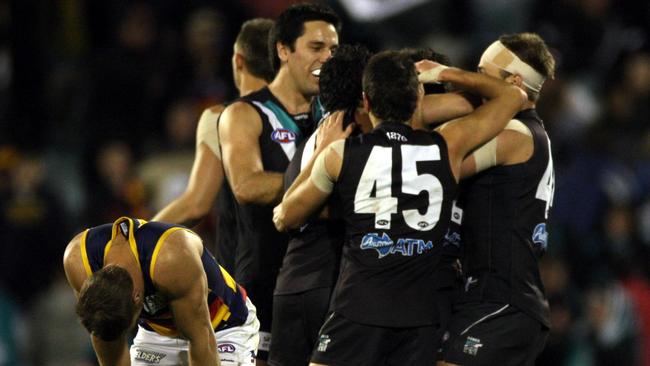 Port players celebrate as Scott Thompson commiserates on the siren after Showdown 29.