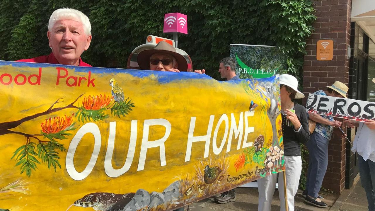 Protestors gather outside Toowoomba City Hall in opposition to Toowoomba Regional Council's plans to develop mountain bike trails through Redwood Park.