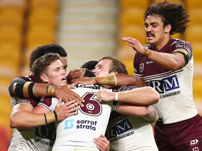 BRISBANE, AUSTRALIA - AUGUST 20: Curtis Sironen of the Sea Eagles celebrates scoring a try with team mates during the round 23 NRL match between the Canberra Raiders and the Manly Sea Eagles at Suncorp Stadium, on August 20, 2021, in Brisbane, Australia. (Photo by Chris Hyde/Getty Images)