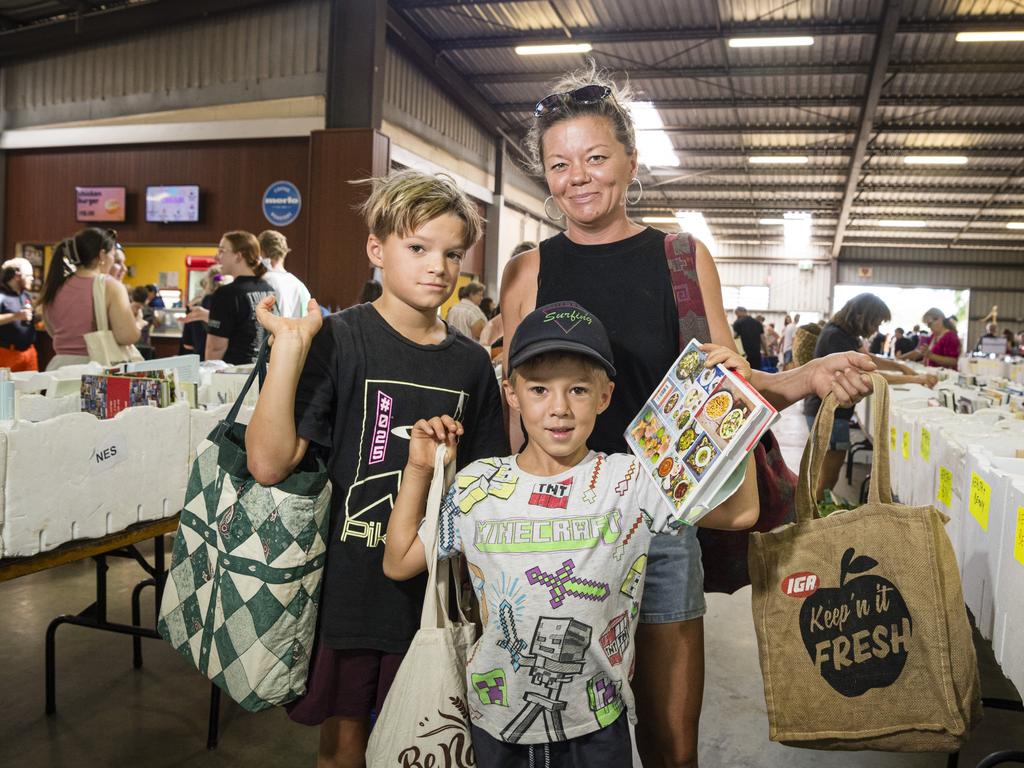 Jessica Ehrlich with sons Darius (left) and Milo Dent show their bags of books at The Chronicle Lifeline Bookfest at Toowoomba Showgrounds, Saturday, March 2, 2024. Picture: Kevin Farmer