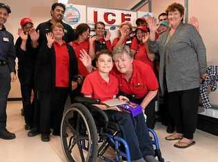 Coles Mooloolaba staff have donated $750 from their social club fund to Kalani Auld, 10, for brand new wheelchair. Coles manager Sharon Wilson is pictured with Kalani in his old wheelchair. Picture: Warren Lynam