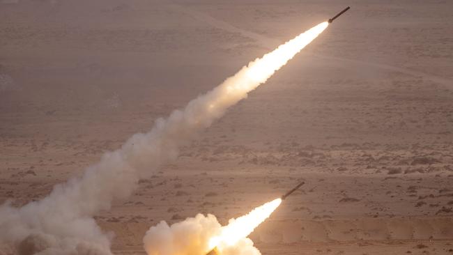 A US M142 High Mobility Artillery Rocket System (HIMARS) fires salvoes during military exercises last month. Picture: AFP