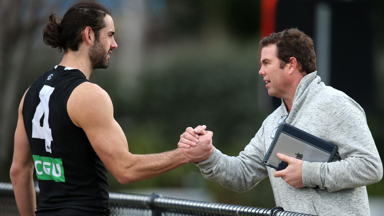 Player manager Paul Connors catches up with client Brodie Grundy at Collingwood training. Picture: Michael Klein