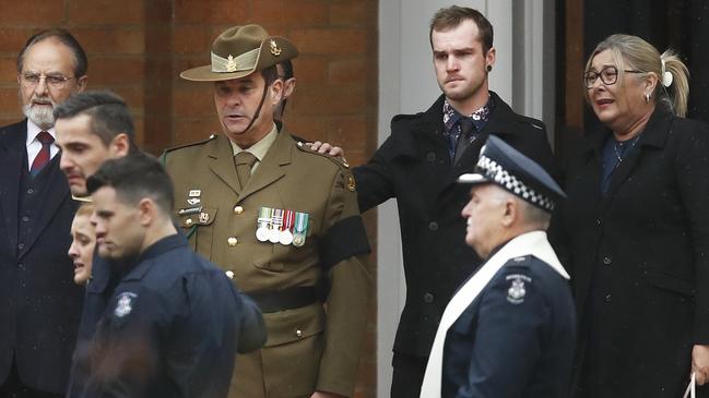 Todd Robinson at the funeral of his fallen partner. Picture: AAP Image/Daniel Pockett