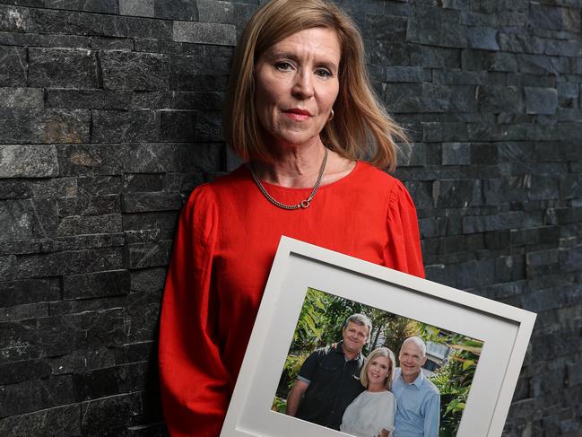 Marita Corbett with a picture of herself with brothers Derek (left) and Brendan Luxton. Picture: Zak Simmonds