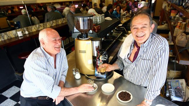 Nino Pangrazio (L) and his partner Sisto Malaspina say stable milk and coffee costs have kept a lid on prices at Pellegrini's cafe in Melbourne, Victoria.