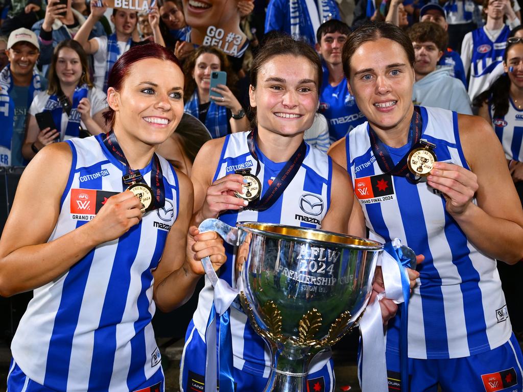 Jenna Bruton, Ash Riddell and Jasmine Garner of the Kangaroos celebrate. Picture: Getty Images