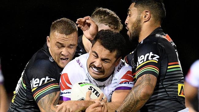 Jahrome Hughes of the Storm is tackled by James Fisher-Harris (left) and Sione Katoa of the Panthers during the Round 3 NRL match between the Penrith Panthers and Melbourne Storm at Carrington Park, in Bathurst, Saturday, March 30, 2019. (AAP Image/Dan Himbrechts) NO ARCHIVING, EDITORIAL USE ONLY