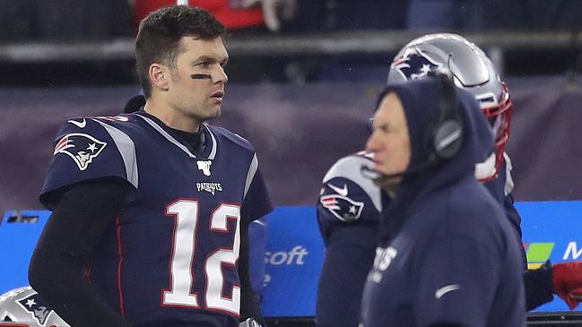 FOXBOROUGH, MA - JANUARY 4: New England Patriots quarterback Tom Brady (12) and head coach Bill Belichick stand on the sidelines during the fourth quarter. The New England Patriots host the Tennessee Titans in the Wild Card AFC Division game at Gillette Stadium in Foxborough, MA on Jan. 4, 2020. (Photo by John Tlumacki/The Boston Globe via Getty Images) Supplied for Garry Ferris