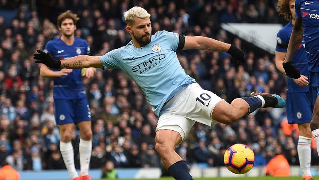 Sergio Aguero scored three times in the 6-0 drubbing. (Photo by Oli SCARFF / AFP) / 