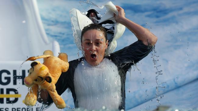 The tennis star reacts to the icy water. Picture: Getty Images