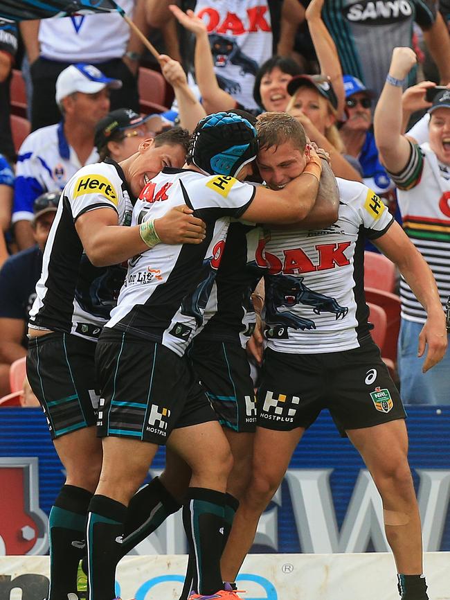 Magic Moment: Players celebrate after Matt Moylan kicked a sideline conversion to win the game against the Bulldogs on the bell. (Mark Evans)