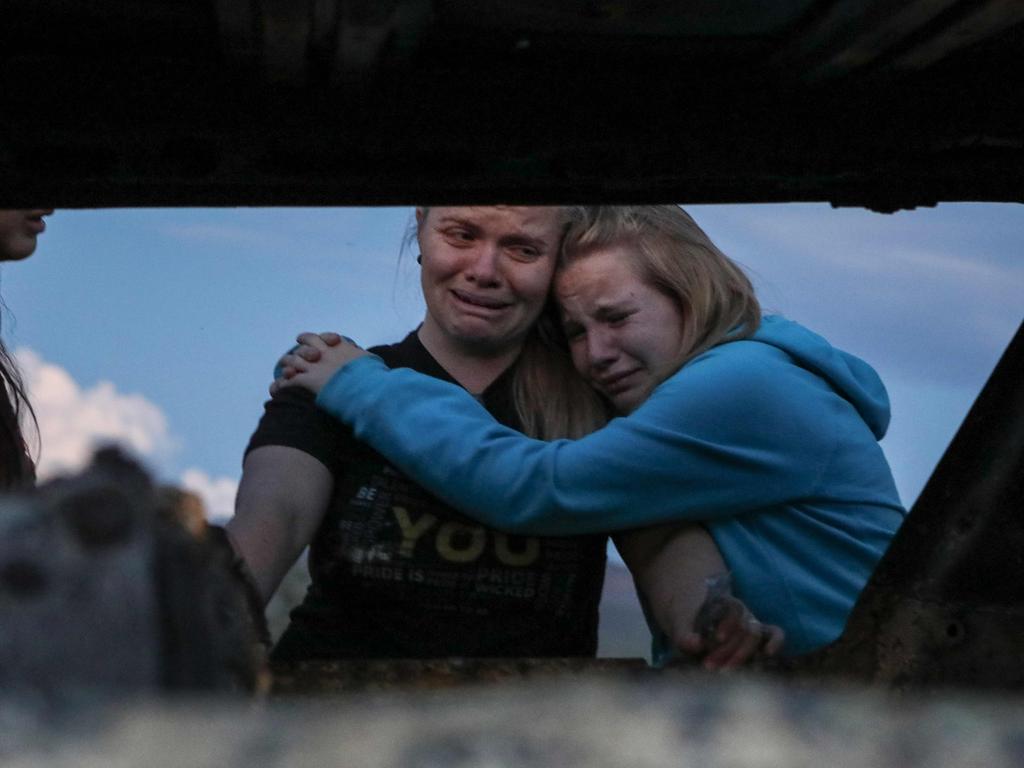 Members of the LeBaron family weep at the scene of the massacre. Picture: Herika Martinez? AFP