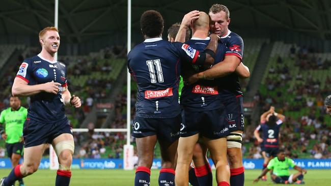 Rebels players celebrate a try to Billy Meakes. Picture: Getty Images