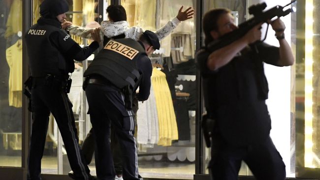 Police search a person in Vienna following the shooting. Picture: Roland Schlager/AFP